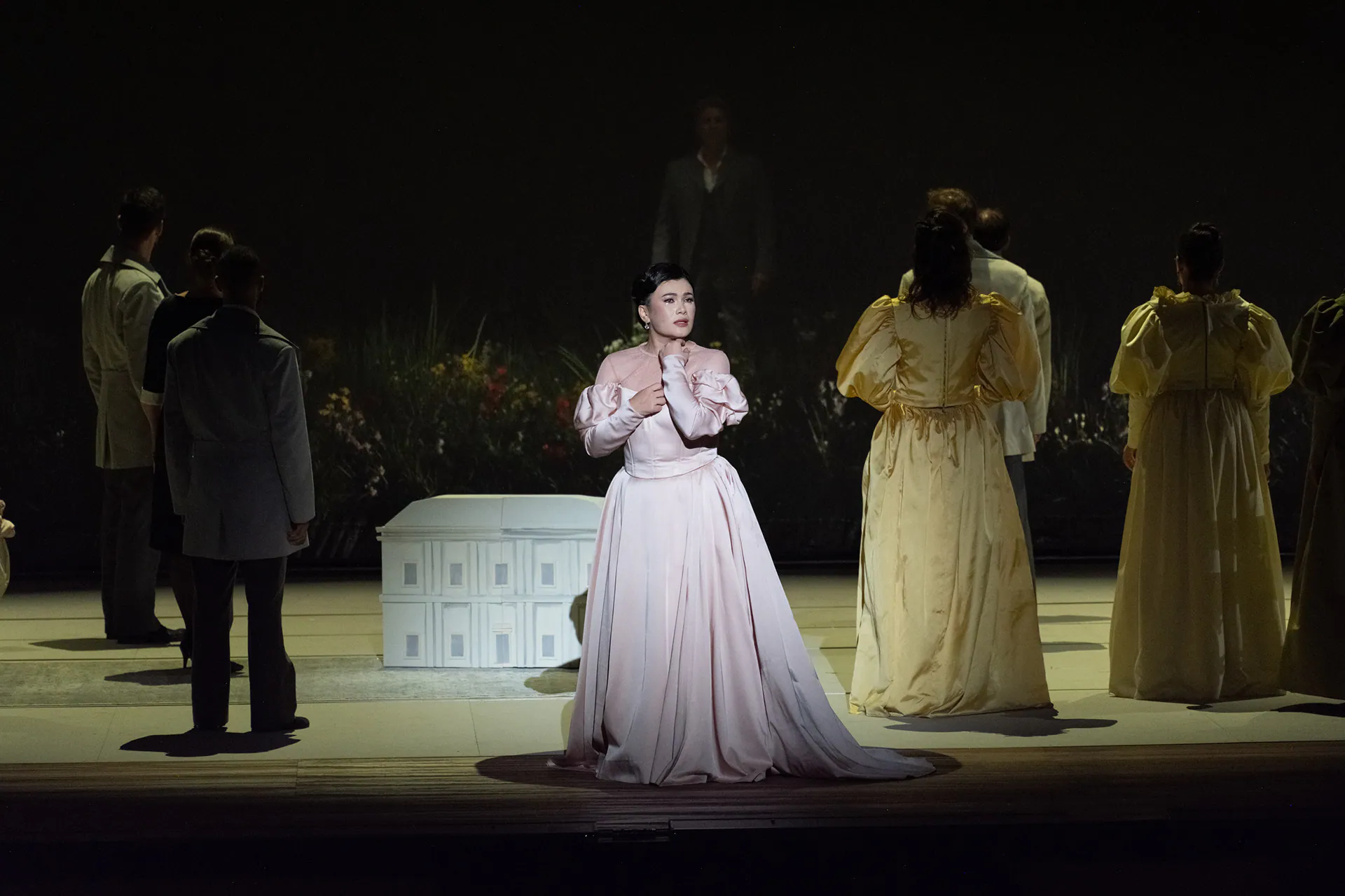 The stage of Francesca da Rimini at Teatro Regio di Torino, with the chorus in pale costumes