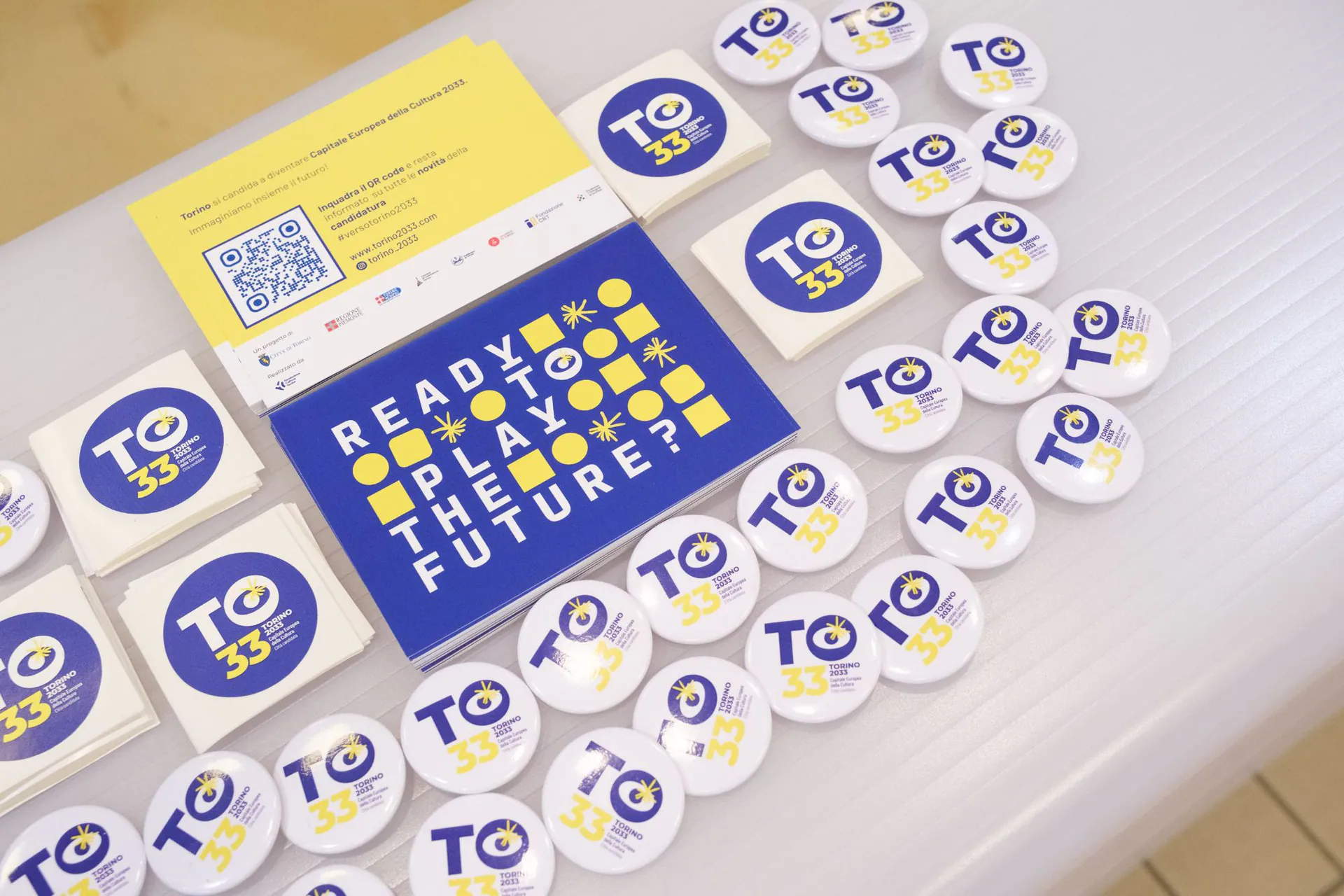 Badges and postcards of Torino 2033, the European Capital of Culture bid