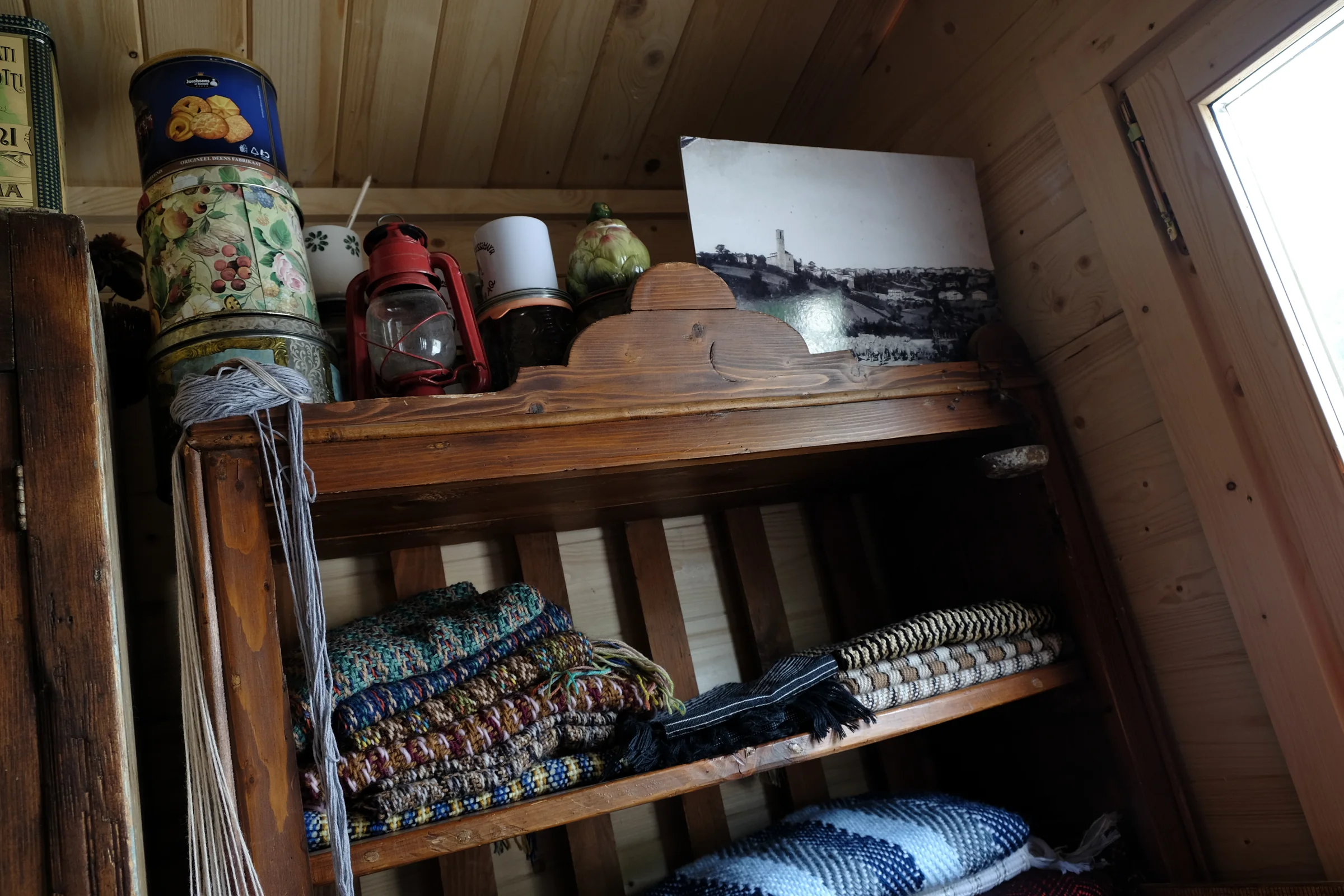 Folded fabrics on wooden shelves