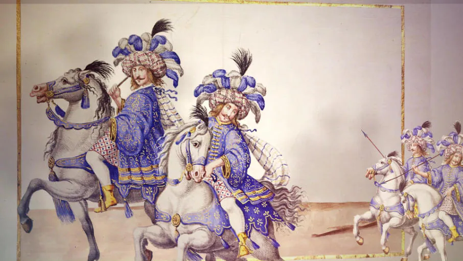 Frame: knights in blue costumes with plumes, galloping